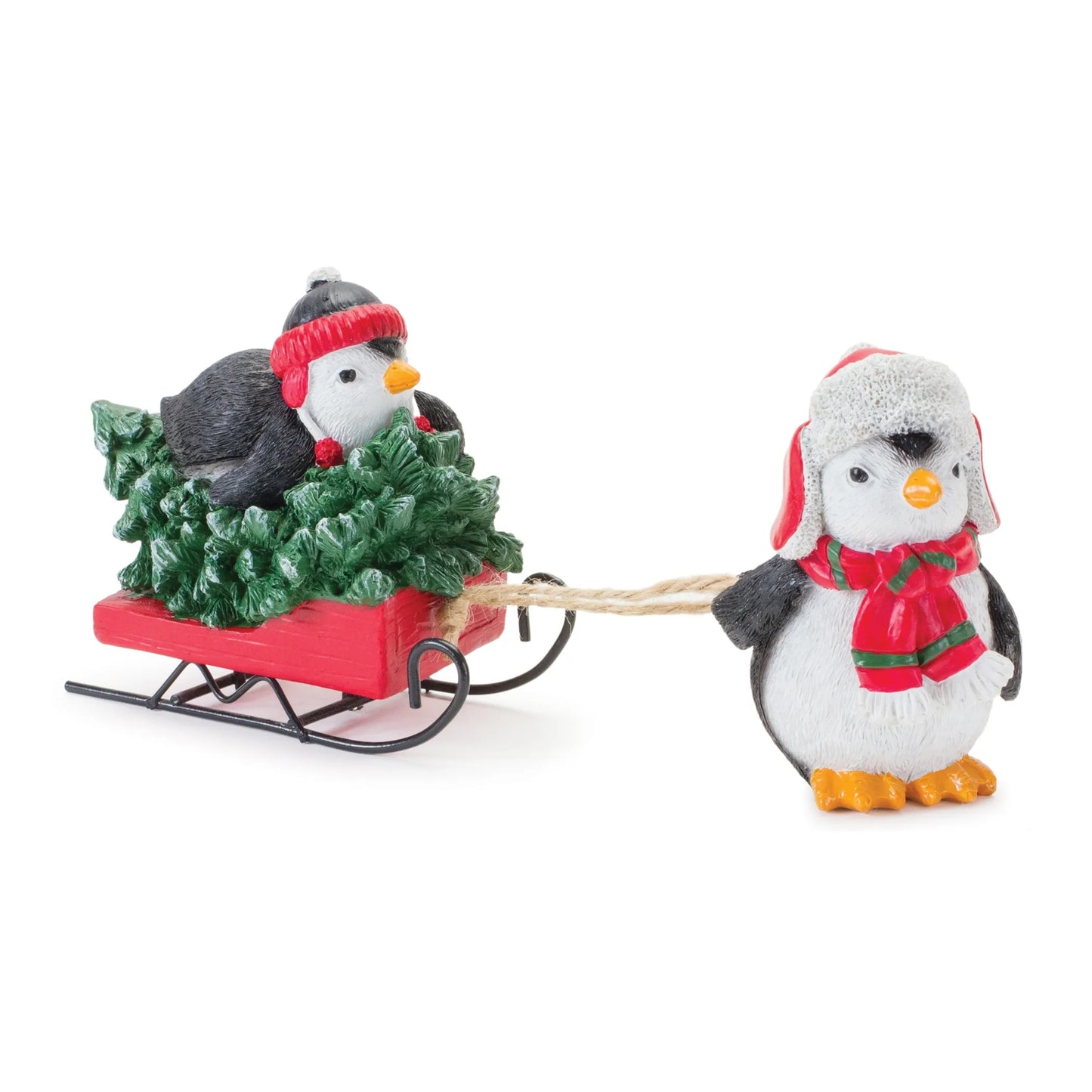 Figuras de pingüinos juguetones con trineo